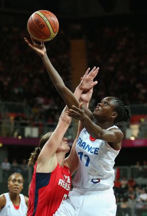 Emilie Gomis, No.11 of France, puts up a shot over Ilona Burgrova, No. 8 of Czech Republic, in the women's basketball quaterfinal.
