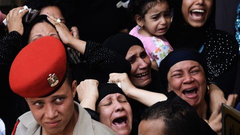 Relatives mourn Tuesday for one of the 16 soldiers killed during an attack on a border crossing post in North Sinai.