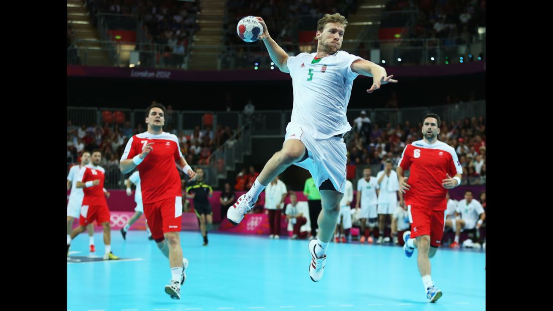 Hungary's Gabor Csaszar scores on a fast break during the men's handball quarterfinal match against Iceland.