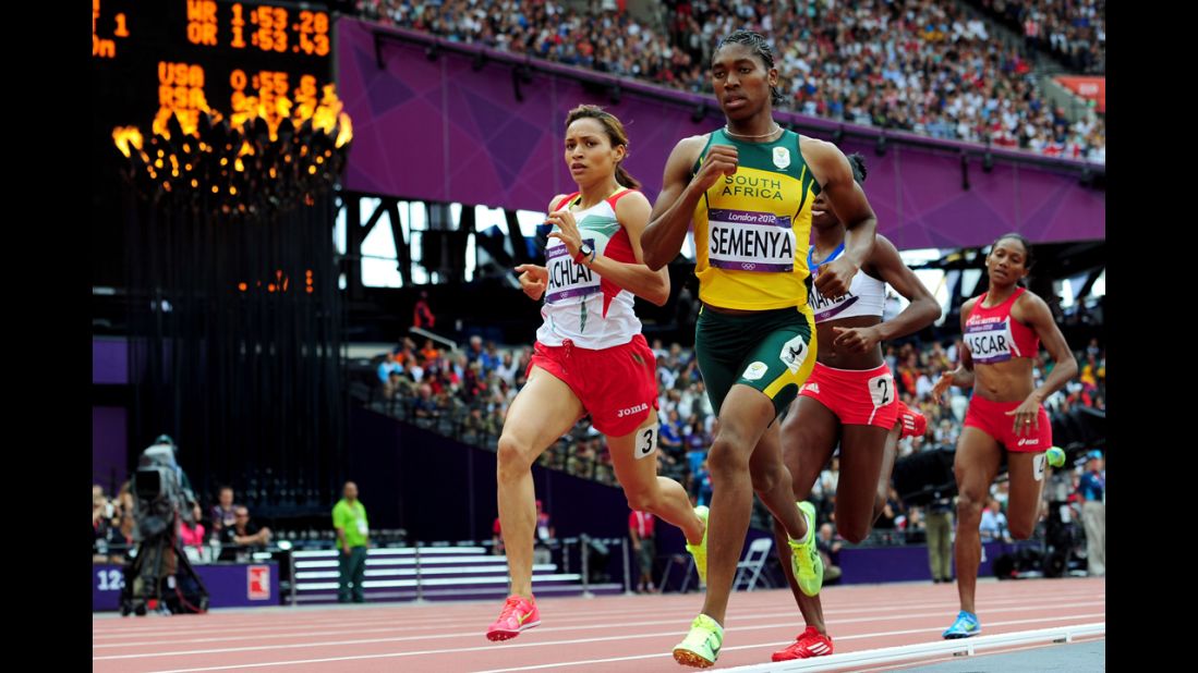 Morocco's Halima Hachlaf, left, and Caster Semenya of South Africa compete in round one of the women's 800-meter heats.