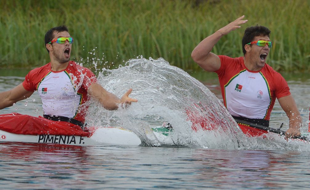Portugal's Fernando Pimenta, left, and Emanuel Silva celebrate winning the silver medal during the men's kayak double 1,000-meter canoe sprint finals in Windsor, England.