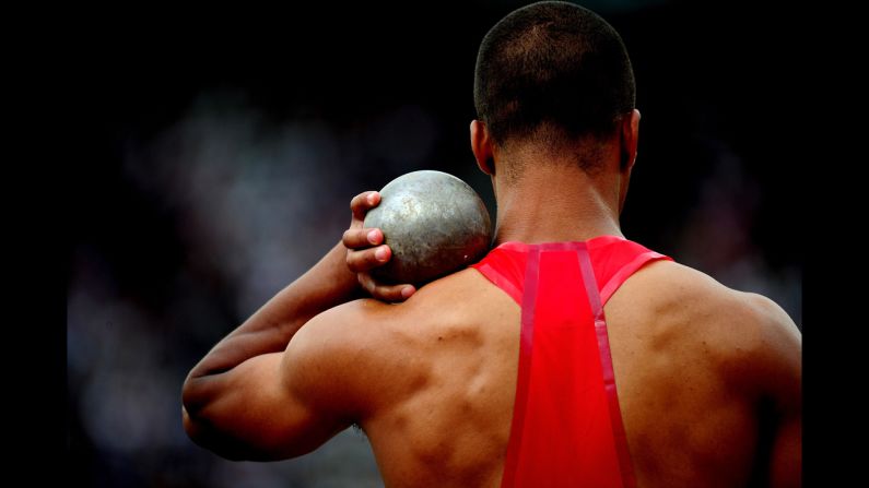 Ashton Eaton of the United States competes in the men's decathlon shot put.
