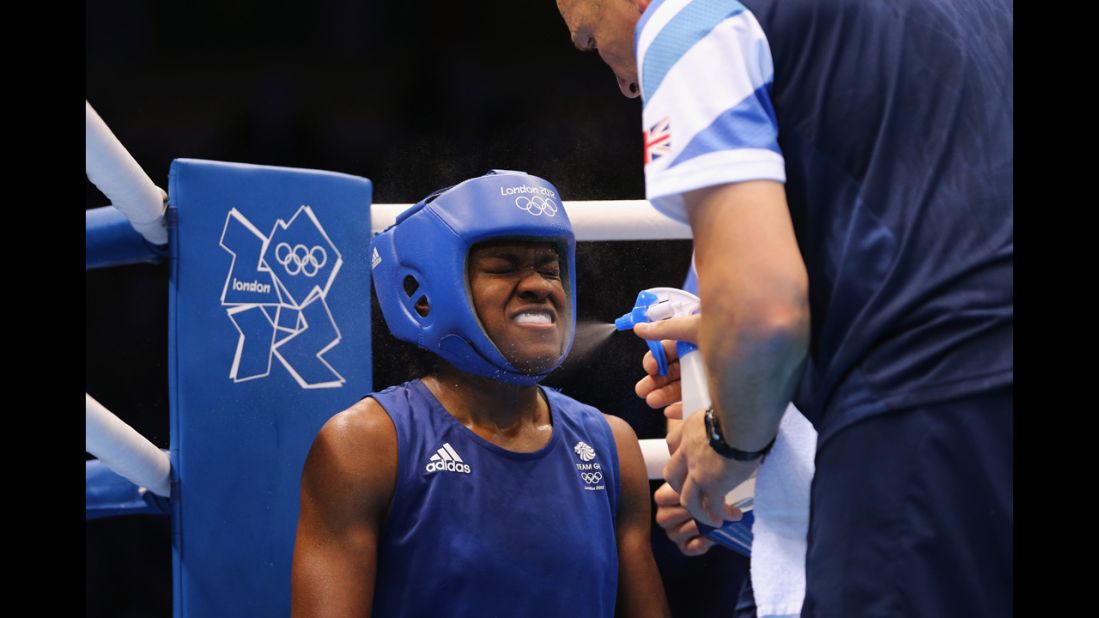 Nicola Adams of Great Britain gets refreshed during the women's fly (51-kilogram) boxing semifinal fight.