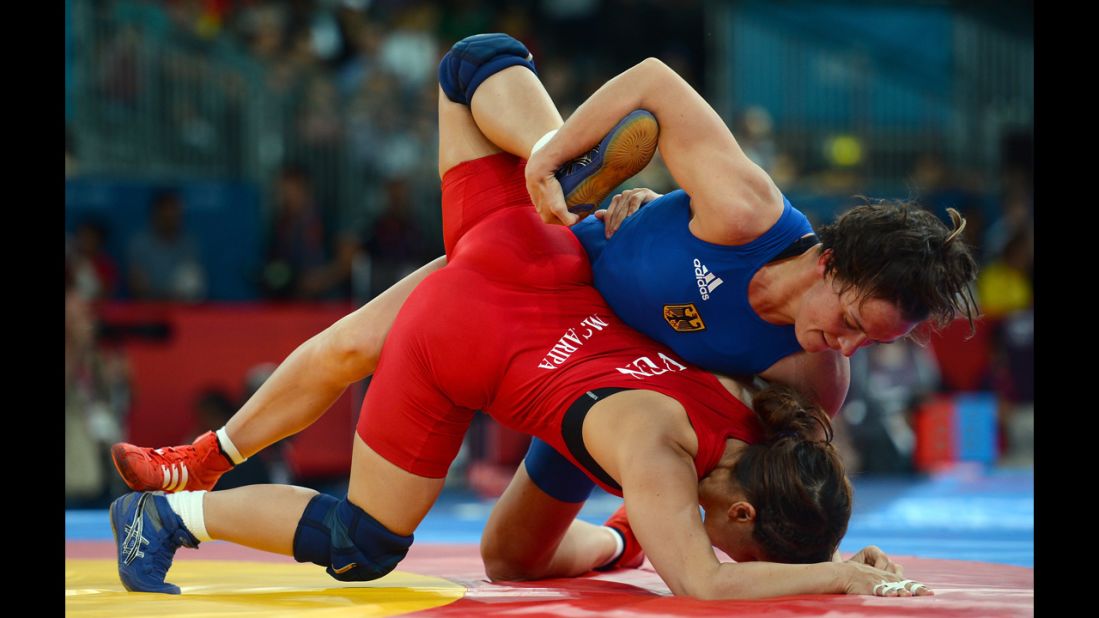 Germany's Alexandra Engelhardt, right, competes against Mayelis Yesenia Caripa Castillo of Venezuela in women's freestyle 63-kilogram wrestling.