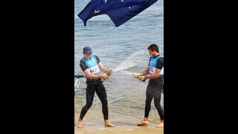 New Zealand's Peter Burling, left, and Blair Tuke celebrate winning silver in the men's 49er sailing final in Weymouth, England.