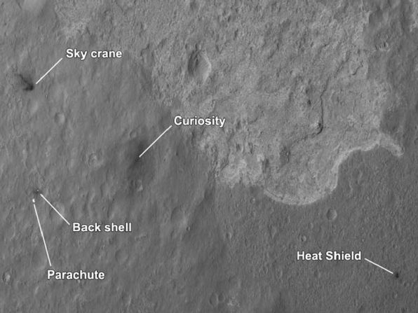 The four main pieces of hardware that arrived on Mars with NASA's Curiosity rover were spotted by NASA's Mars Reconnaissance Orbiter. The High-Resolution Imaging Science Experiment camera captured this image about 24 hours after landing. 