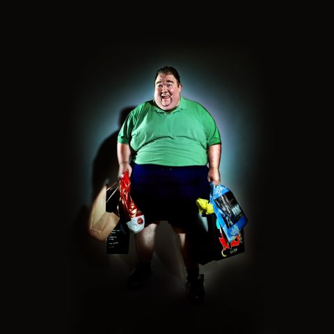 To achieve harsh shadows and a Hitchcock feel, Mellia put a bright spotlight on his subjects, plunging the background into harsh shadows. Representing the consumer in his "Wall Street" series, Mellia used 400-600 pound models.
