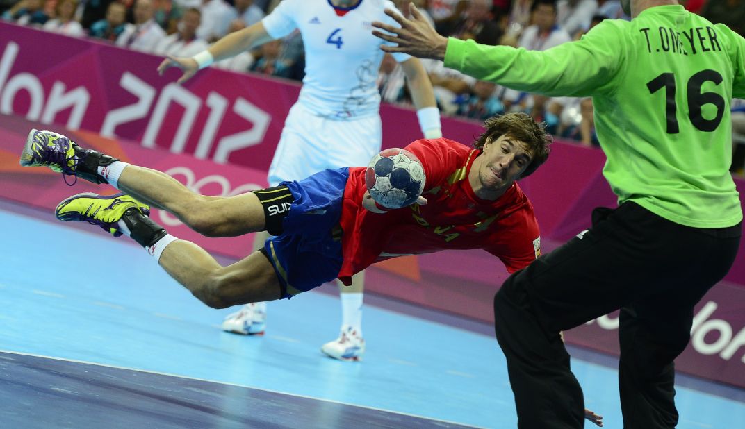 Spain's Albert Rocas Comas shoots during the men's quarterfinal handball match against France.