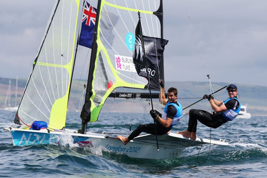 Blair Tuke, left, and Peter Burling of New Zealand celebrate winning silver in the men's 49er sailing event in Weymouth, England.