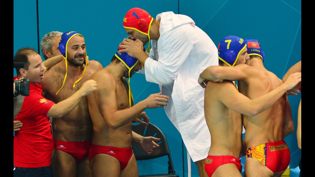 Montenegro's water polo team celebrates its victory over Spain during the men's water polo quarterfinal match.