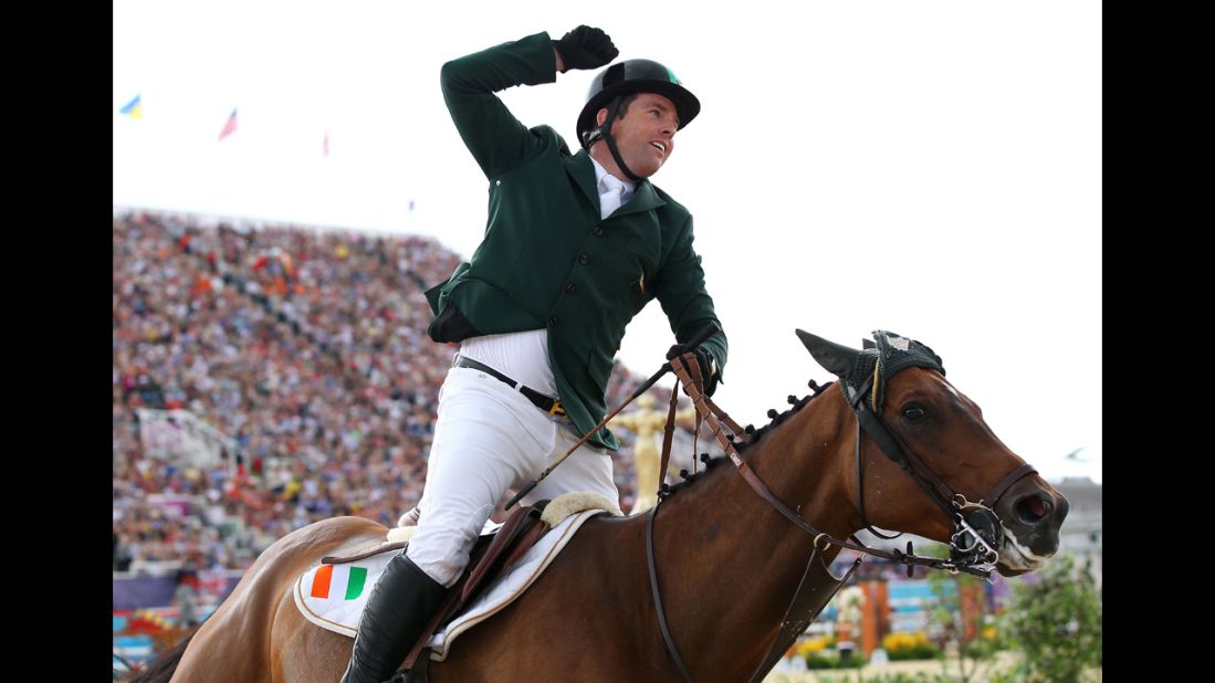 Ireland's Cian O'Connor riding Blue Loyd 12 celebrates winning the bronze in the individual jumping equestrian event.