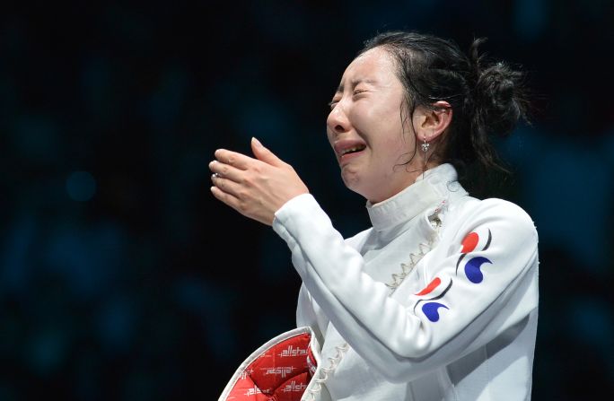 South Korea's Shin A-Lam gets emotional while awaiting the outcome of an appeal over a technical fault during her Women's Epee semifinal bout against Germany's Britta Heidemann.