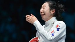 South Korea's Shin A-Lam gets emotional while awaiting the outcome of an appeal over a technical fault during her Women's Epee semifinal bout against Germany's Britta Heidemann.