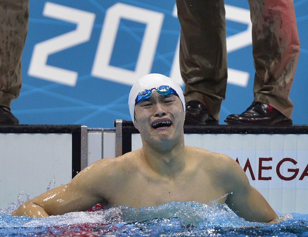 China's Sun Yang couldn't wait to get out of the pool to celebrate his gold medal win in the men's 1,500-meter freestyle.