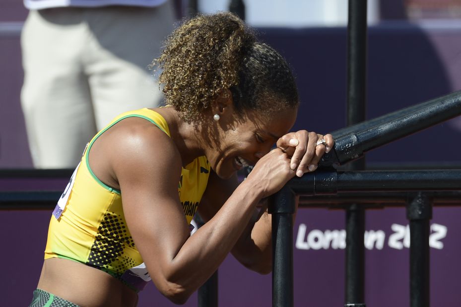 Jamaica's Brigitte Foster-Hylton cries after sustaining an injury running the women's 100-meter hurdles.