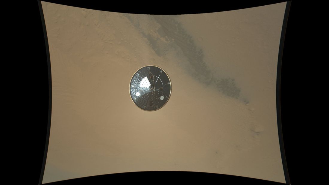 This color full-resolution image showing the heat shield of NASA's Curiosity rover was obtained during descent to the surface of Mars on August 13, 2012. The image was obtained by the Mars Descent Imager instrument known as MARDI and shows the 15-foot diameter heat shield when it was about 50 feet from the spacecraft. 