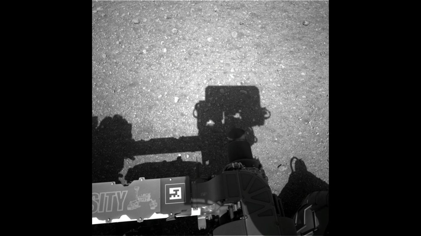 This first image taken by the Navigation cameras on Curiosity shows the rover's shadow on the surface of Mars.