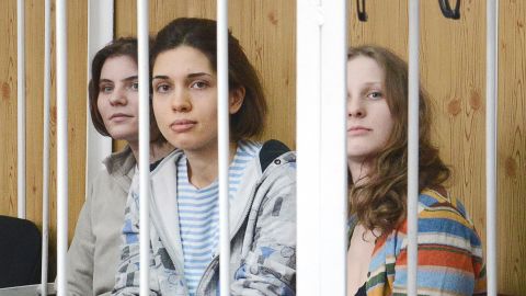 Members of female punk band 'Pussy Riot' sit behind the bars during a court hearing in Moscow on July 20, 2012.