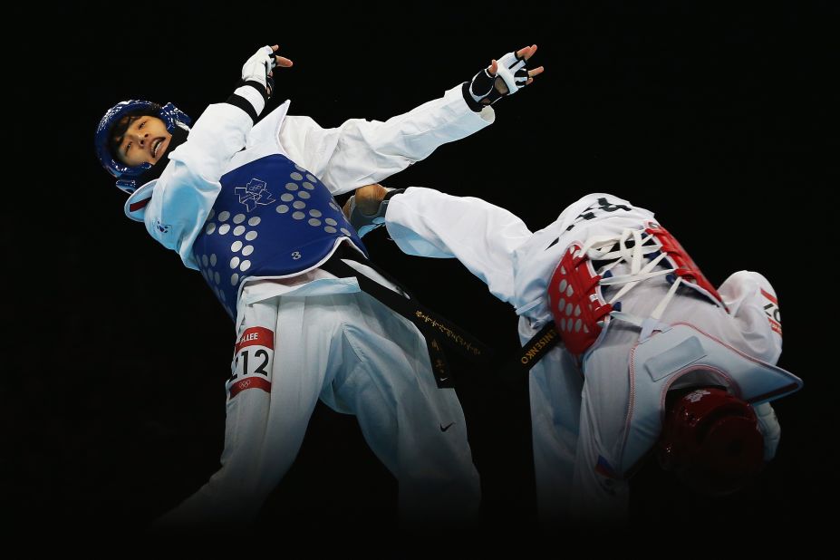 Lee Dae-Hoon of South Korea competes against Alexey Denisenko of Russia during the men's 58-kilogram semifinal taekwondo match.