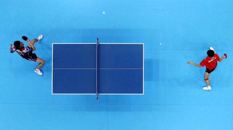 Jike Zhang of China, right, competes against Joo Se-Hyuk of South Korea.