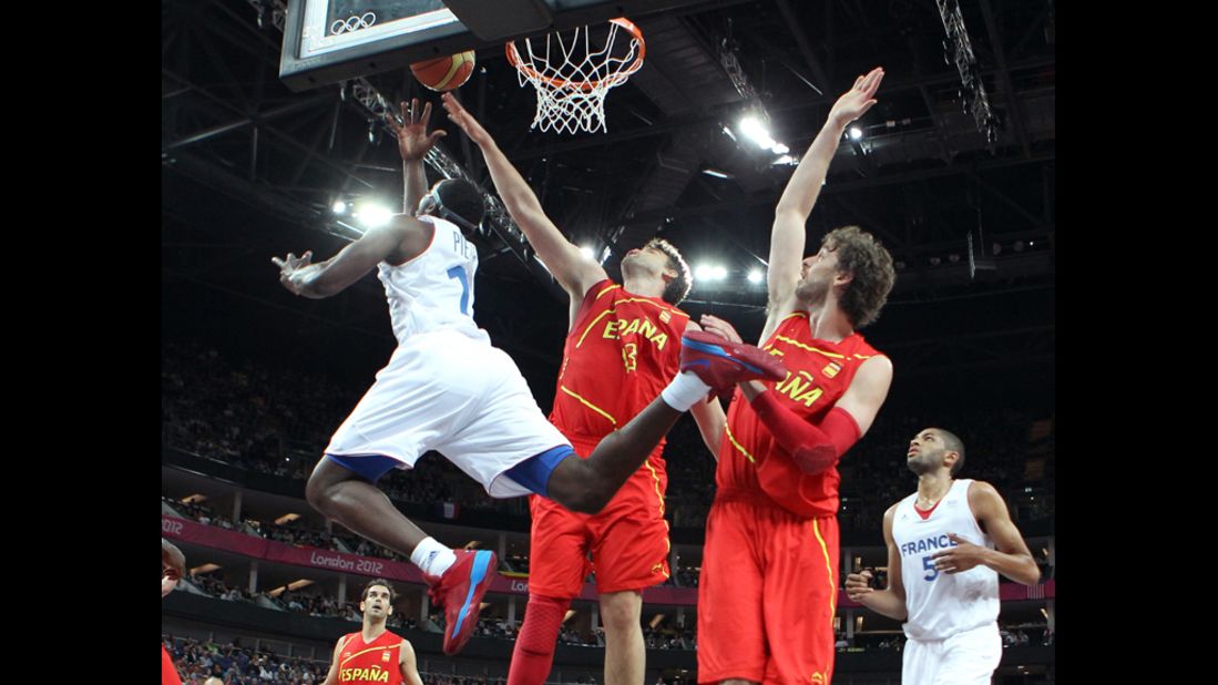 Florent Piétrus of France goes up for a shot against Marc Gasol of Spain in the first half of their men's basketball quarterfinal game.