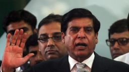 Pakistan's new Prime Minister Raja Pervez Ashraf (C) speaks to the media at the coalition party headquarters of Muttahida Qaumi Movement (MQM) in Karachi on June 25, 2012. Pakistan's new prime minister condemned cross-border attacks from Afghanistan and said he would discuss the matter with President Hamid Karzai, a day after six Pakistani soldiers were killed. AFP PHOTO / Rizwan TABASSUM (Photo credit should read RIZWAN TABASSUM/AFP/GettyImages) 