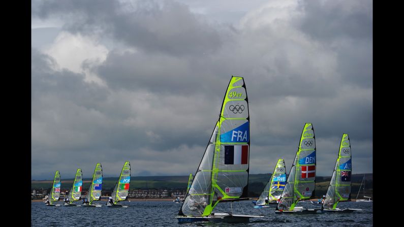 The boats take off for the start of the men's 49er sailing in Weymouth Harbour.