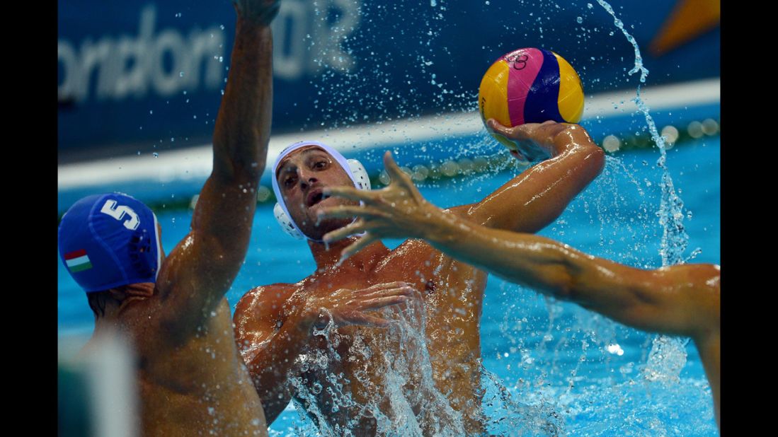 Italian water polo player Valentino Gallo faces off with Hungarian Tamas Kasas, left, during the men's quarterfinal match. 