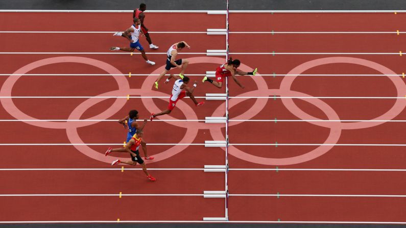 U.S. hurdler Jason Richardson leads Cuba's Orlando Ortega and Great Britain's Lawrence Clarke in the men's 110-meter hurdles semifinal.