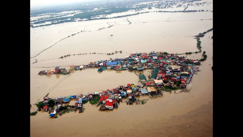 Houses swamped by floodwaters in Bulacan province, north of Manila, in an aerial photograph released by the Department of National Defense on Wednesday.