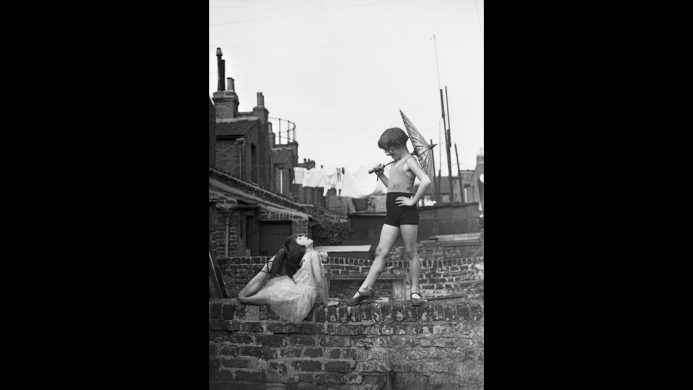 Two young ballet dancers, Violet Hutchinson aged eight, and Betty Putt aged seven, rehearse in a back garden in Poplar in June 1935. This image is taken from the recent exhibition <a href="http://www.gettyimagesgallery.com/exhibitions/archive/east.aspx" target="_blank" target="_blank">EAST</a>, which was held at the Getty Images Gallery, Stratford, London during spring 2012  (Getty Images).