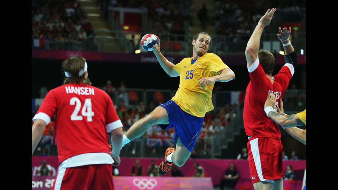 Kim Ekdahl du Rietz of Sweden goes up to shoot against Denmark during the men's quarterfinal match.