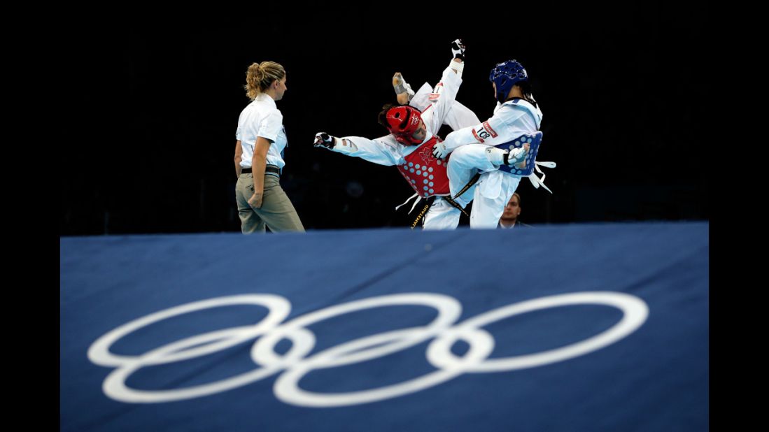 Erika Kasahara of Japan, right, competes against Elizabeth Zamora Gordillo of Guatemala during the women's -49kg taekwondo repechage match.