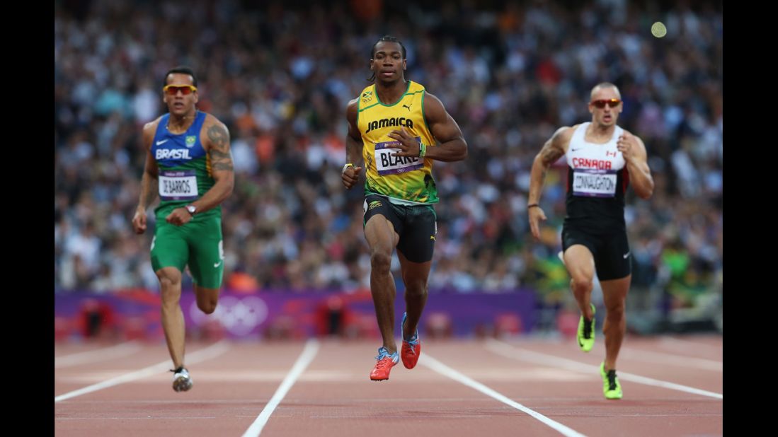 Yohan Blake of Jamaica leads Bruno De Barros of Brazil and Jared Connaughton of Canada in the men's 200-meter semifinals.