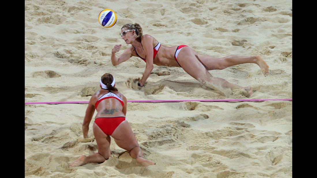 Kerri Walsh Jennings of the United States, top, dives for the ball during the women's beach volleyball gold medal match on Day 12 of the London 2012 Olympic Games at the Horse Guards Parade on Wednesday, August 8. She and teammate Misty May-Treanor were playing another duo of Americans: April Ross and Jennifer Kessy.
