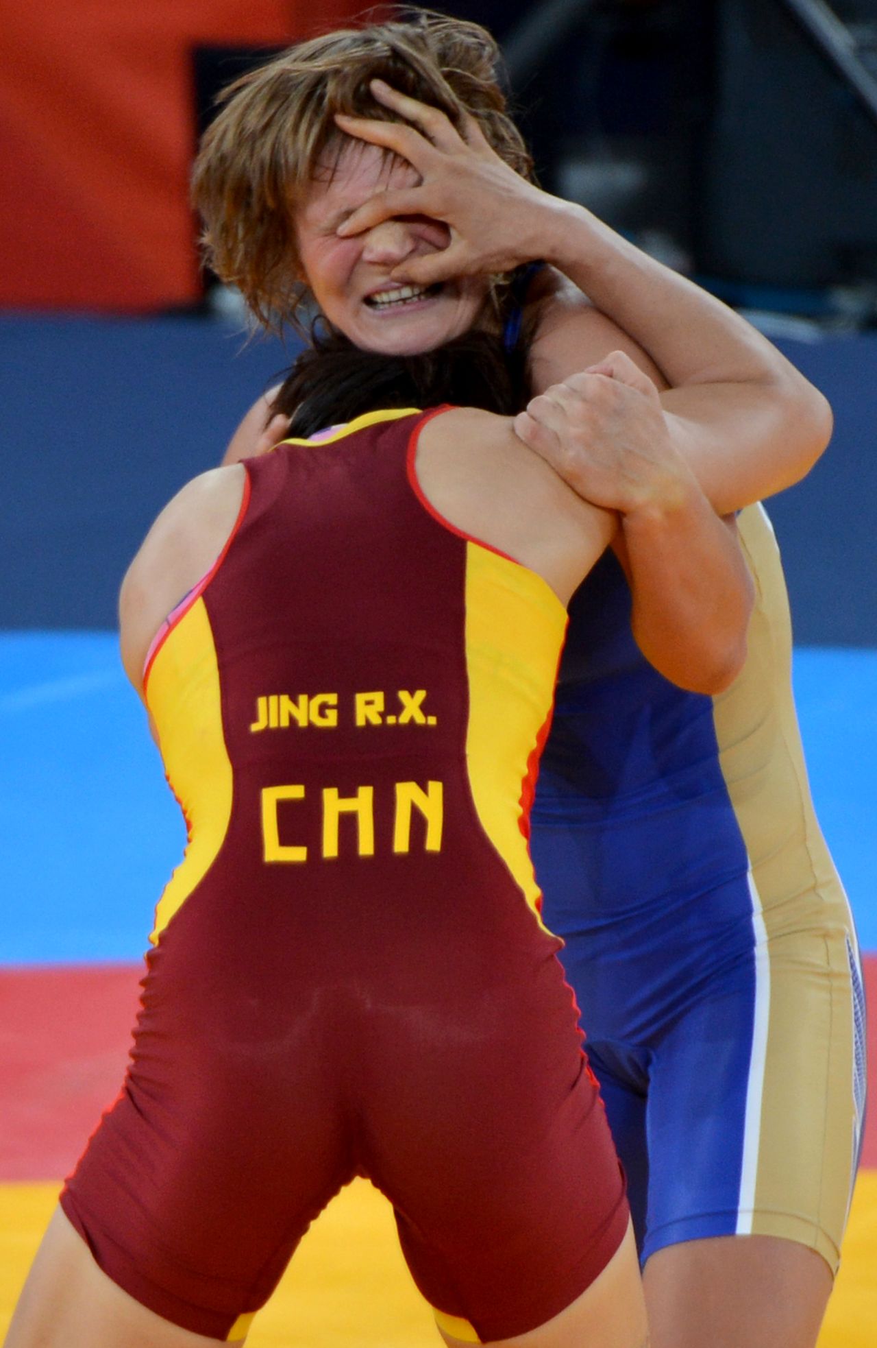 Russia's Lubov Volosova (top) broke the hold by sneezing.