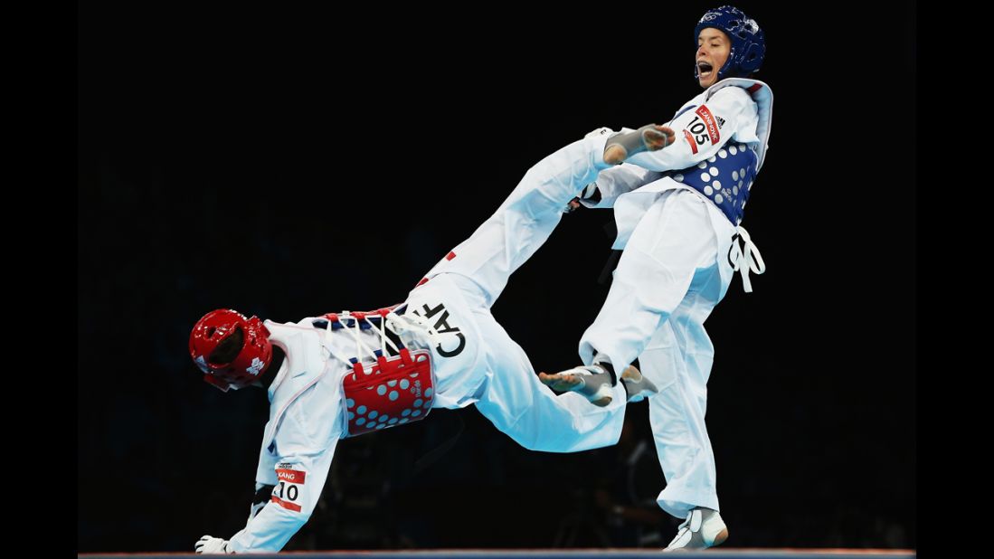 Seulki Kang, left, of the Central African Republic competes against Lucija Zaninovic of Croatia during the women's taekwondo under 49-kilogram preliminary round.