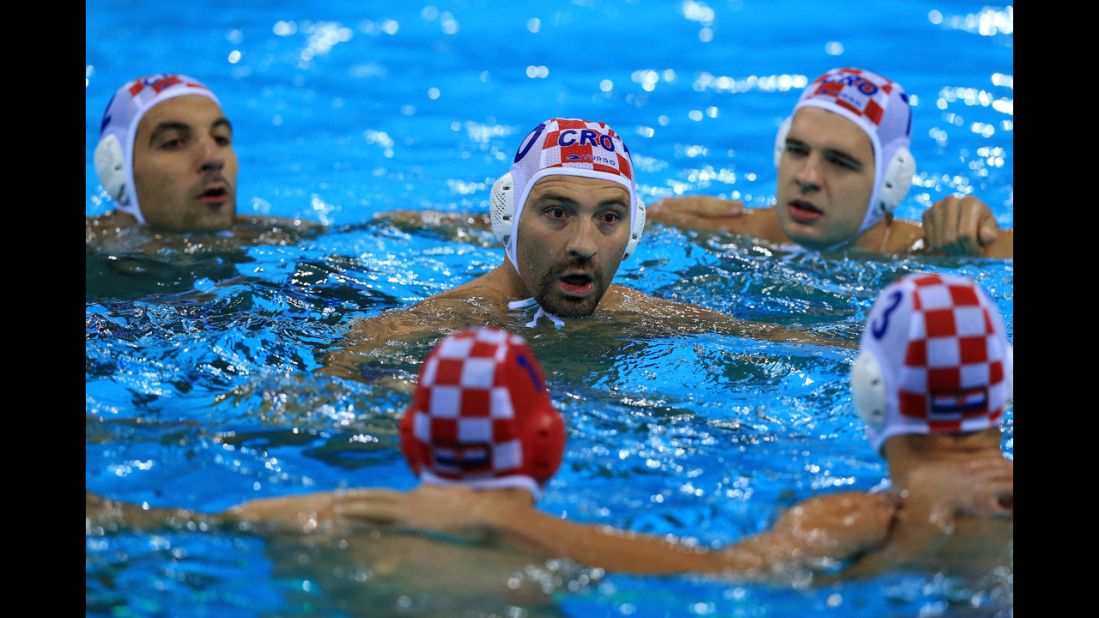 Samir Barac of Croatia speaks to his players in the men's water polo quarterfinal match between Croatia and the United States.