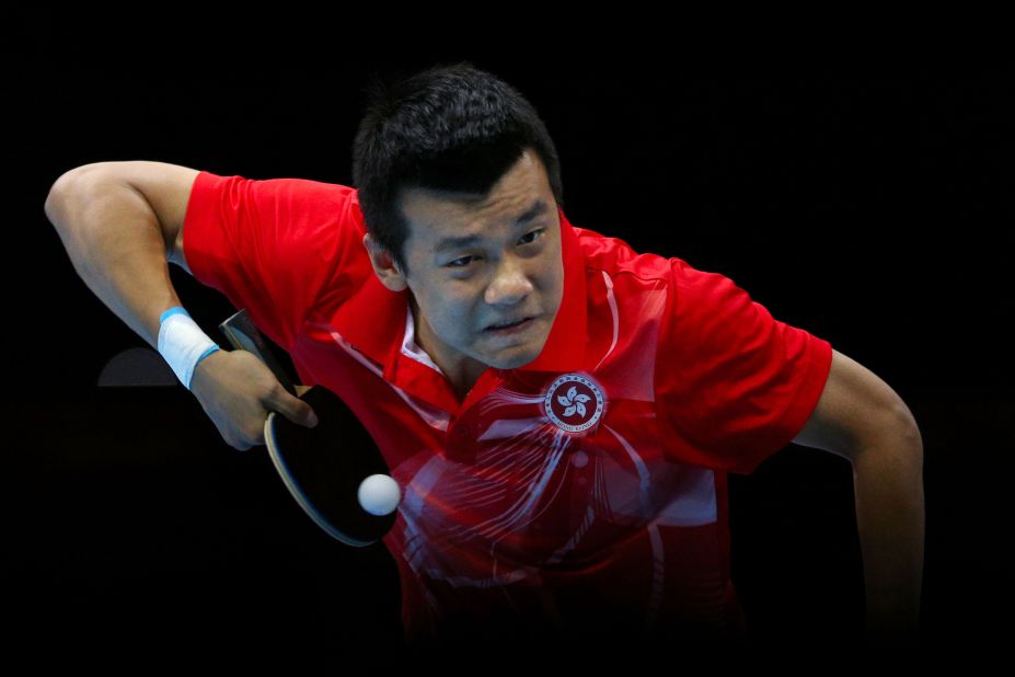 Peng Tang of Hong Kong competes in the men's team table-tennis bronze medal match.