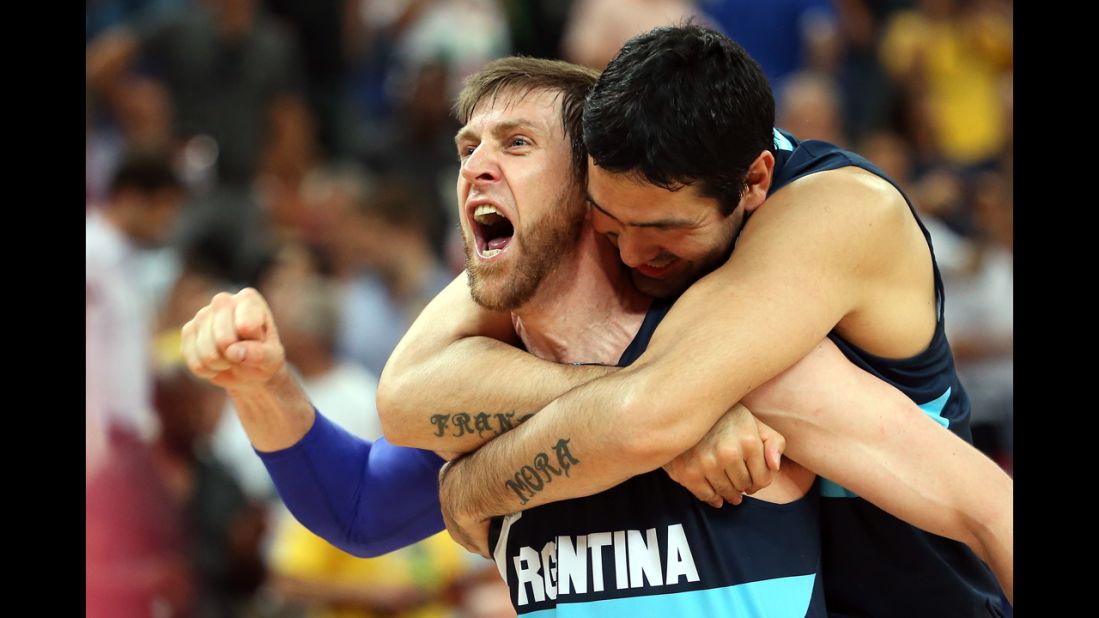 Andres Nocioni, No.13, and Martin Leiva, No.12, of Argentina celebrate Argentina's 82-77 victory against Brazil during the men's basketball quarterfinal.