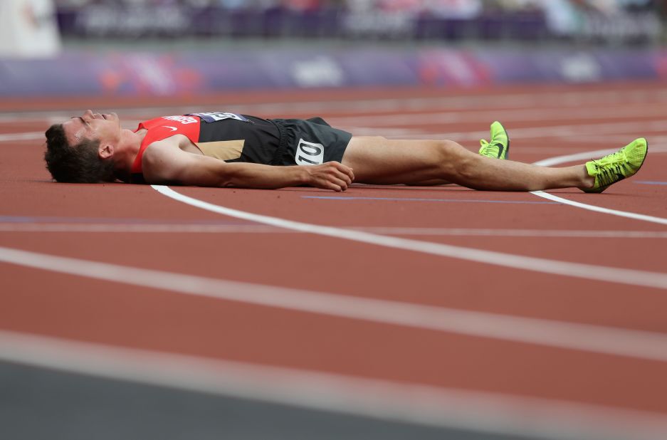 Germany's Arne Gabius rests after round one of the men's 5,000-meter heats.