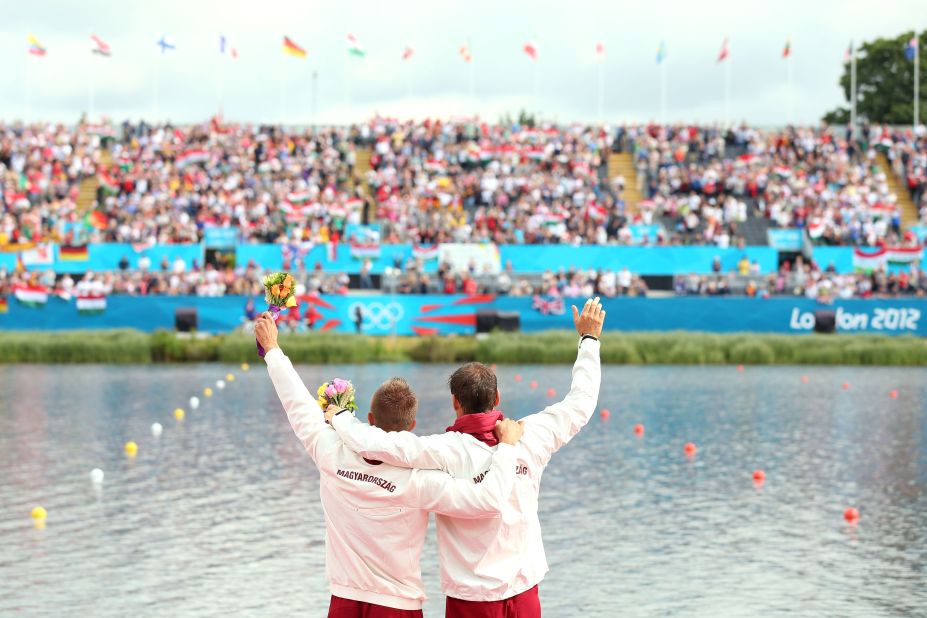 Hungary's Roland Kokeny and Rudolf Dombi celebrate winning gold in the men's kayak double 1,000-meter canoe sprint final in Windsor, England.