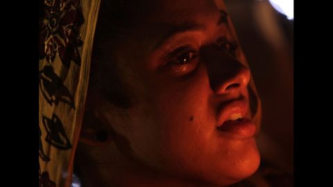 A woman from the Sikh Temple of Wisconsin mourns during a candlelight vigil Tuesday, August 7, at the Oak Creek Community Center in Oak Creek, Wisconsin.