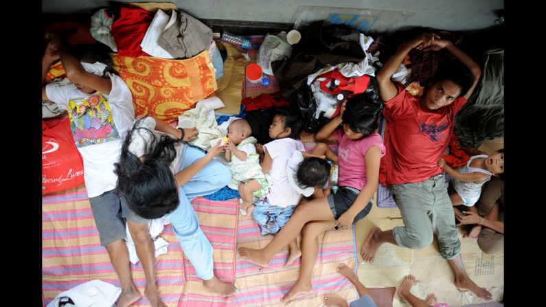 Flood victims take shelter in a church used as an evacuation center in Quezon City, suburban Manila.