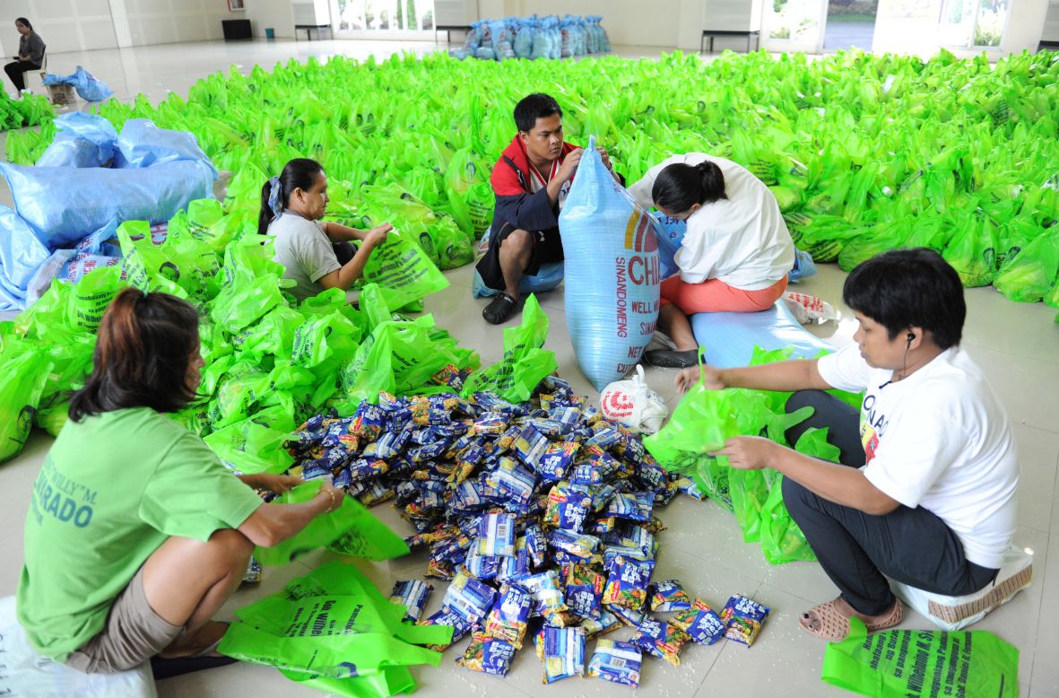 Volunteers bag relief goods for flood victims in Bulacan, north of Manila.