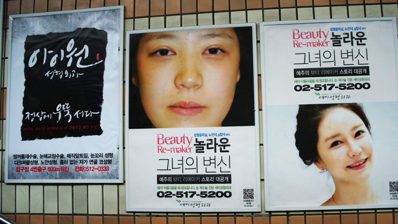 Ads for cosmetic plastic surgery dominate the walls of Seoul's Apgujeong station. 