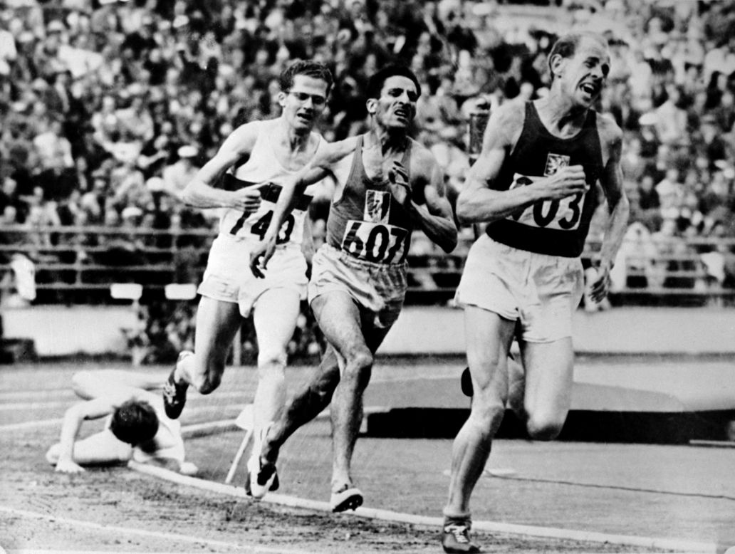 Zatopek sprints to 5,000m gold in Helsinki from Alain Mimoun (France) and Herbert Schade (Germany) with Britain's Chris Chataway falling on the final bend. He also won the 10,000m and marathon -- a feat never repeated.