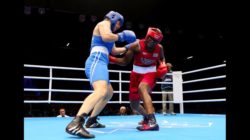 Claressa Shields of the United States, right, exchanges punches with Nadezda Torlopova of Russia during the women's middleweight boxing final.