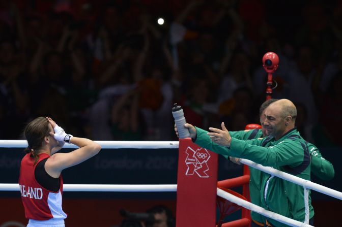 Katie Taylor of Ireland celebrates her defeat of Sofya Ochigava of Russia to win gold during the women's boxing lightweight final.