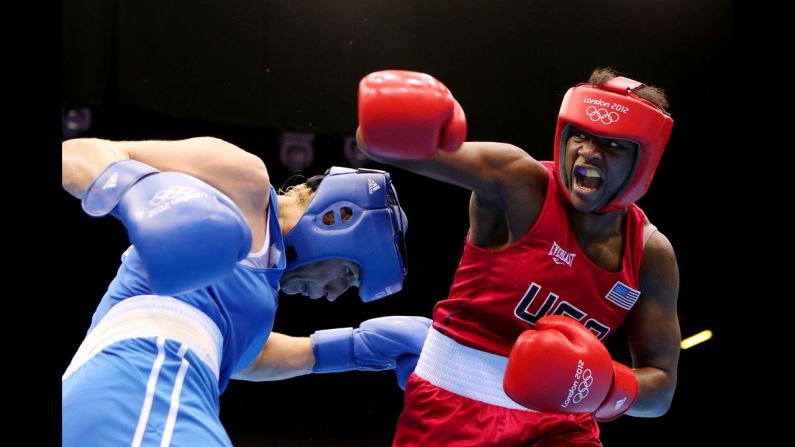 Claressa Shields, in red, battles Nadezda Torlopova of Russia during the women's middleweight boxing final. Shields defeated Torlopova 19-12 to take the gold, becoming the first U.S. woman to take an Olympic boxing gold. <a href="index.php?page=&url=http%3A%2F%2Fcnnphotos.blogs.cnn.com%2F2012%2F07%2F20%2Ft-rex-the-youngest-female-olympic-boxer%2F" target="_blank">See more photos of Shields and read her story on CNN's photo blog</a>.